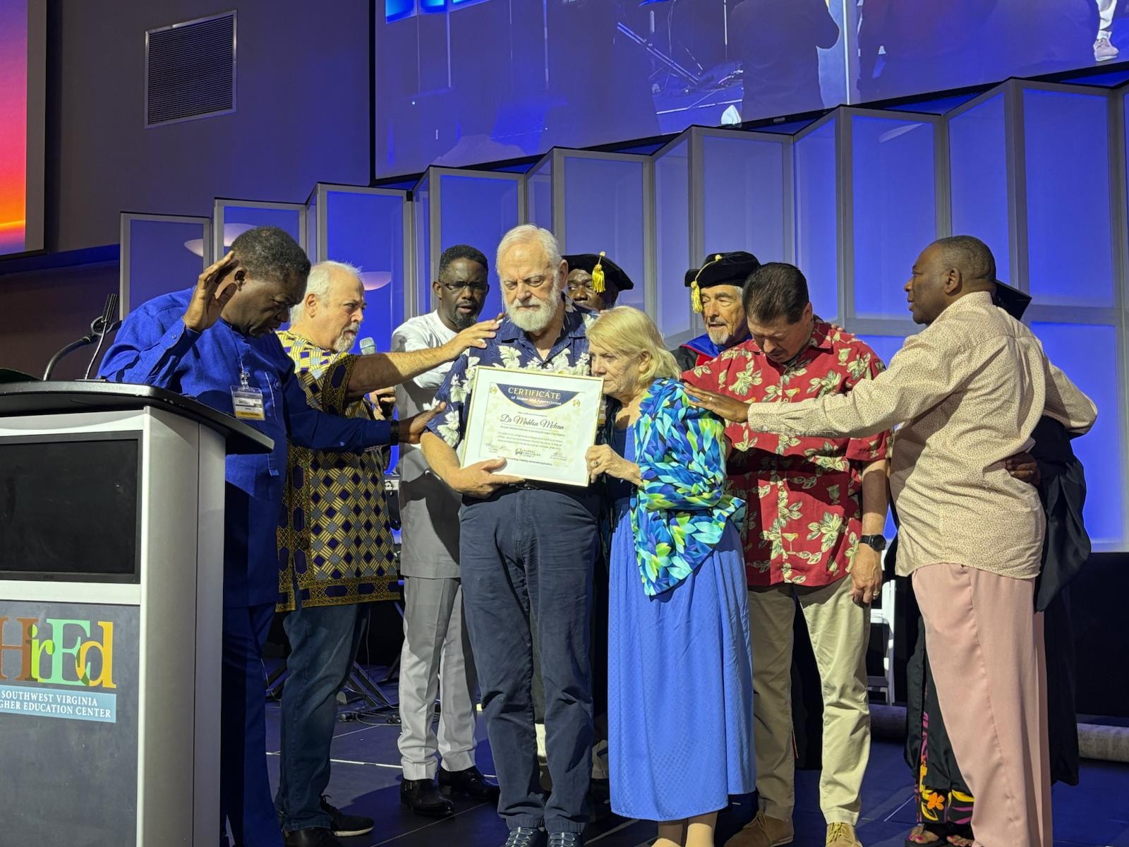 Group receiving award on stage